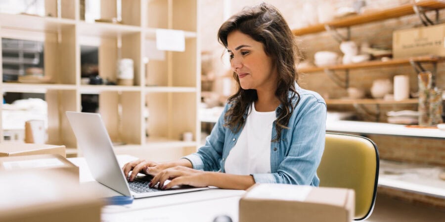 self employed woman working at laptop