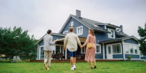 home owners tax credit, happy family in front of new home