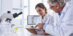 R&D expenditures, scientists with microscope
